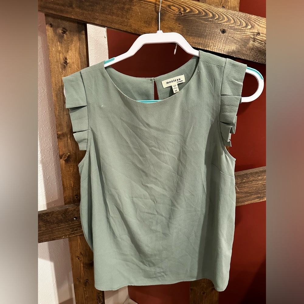 Light green colored blouse. Size medium
